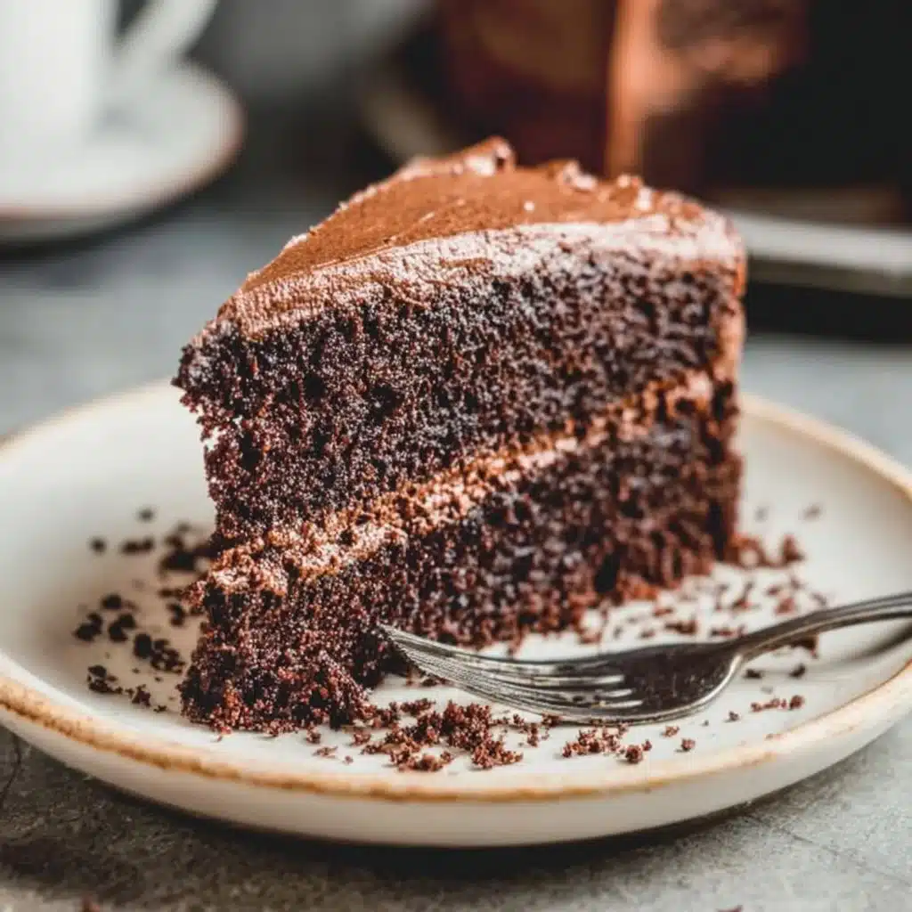 Homemade Hershey chocolate cake topped with creamy chocolate frosting
