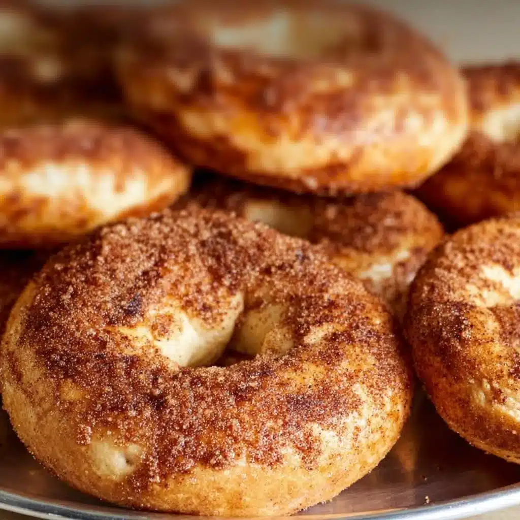 Irresistible Cinnamon Sugar Bagels Recipe for Cozy Moments 3 Freshly baked cinnamon sugar bagels on a wooden table