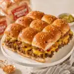 Delicious cheeseburger sliders served on a platter with toppings